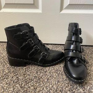 Black Chelsea boots with studs and buckles